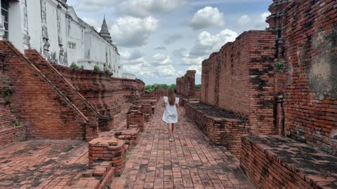 Attractive Girl walking the ancient ruins of a vast ancient empire