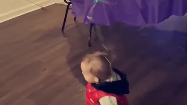 Mom Hack Tying Balloon to Toddlers Hair