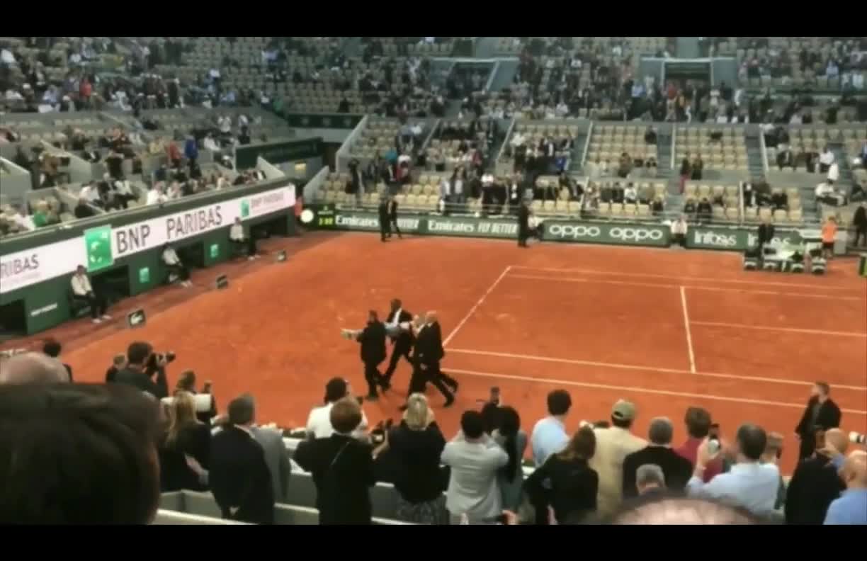 A climate extremist ran into the court at the French Open and tied herself to the net.