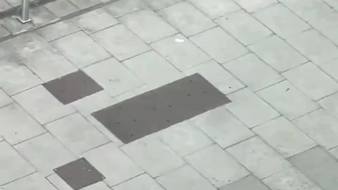 A male on a bike riding around with a large knife in London..