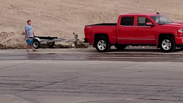 Dad Gets Impatient While Teaching Daughter to Back Trailer Down Boat Ramp