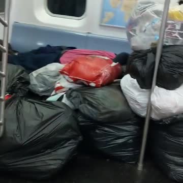 Subway train full of trash walk by