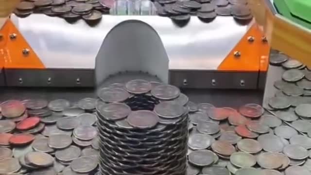 Giant tower of coins in a coin pusher! #shorts