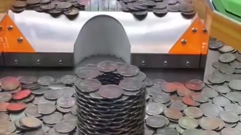 Giant tower of coins in a coin pusher! #shorts