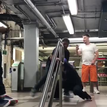 Two kids blue gloves red gloves boxing subway train station
