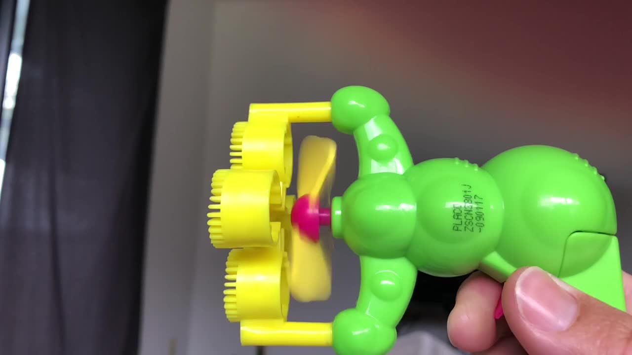 Slow Motion Of Fan On Bubble Gun