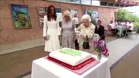 Queen cuts cake with sword