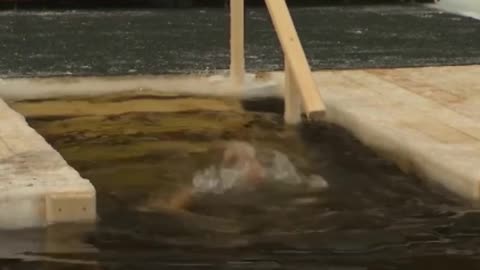 Putin baptizes on the Epiphany