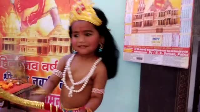 The little boy is doing a very beautiful dance.