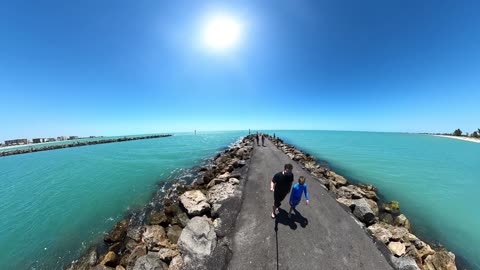 Walking the #270Pro Backpack S Selfie Stick with a GoPro Max at the beach.