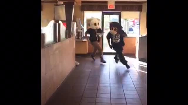 Guy in white rabbit costume fights guy in bear costume in mcdonalds