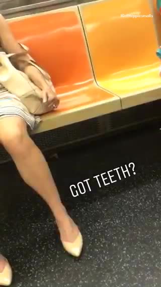 Got teeth? dentures under orange subway train seat
