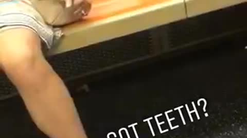 Got teeth? dentures under orange subway train seat