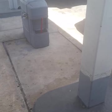 Two men looking under truck