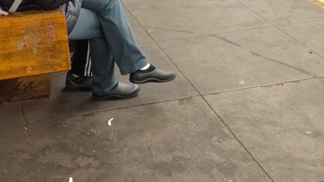 Woman in black jacket eating popcorn