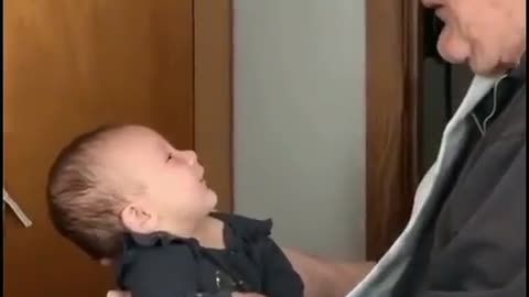 Baby playing with Grandmother