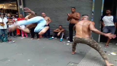 Two incredible scissors in the Roda de Capoeira.