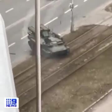 Disturbing footage has captured the moment a Russian tank swerved TOWARDS a civilian vehicle .