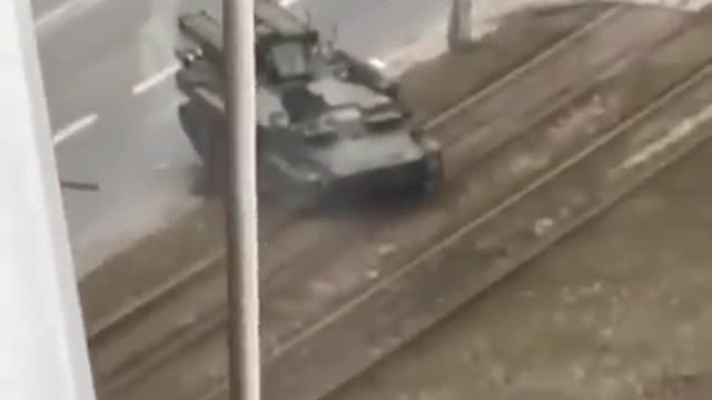 Disturbing footage has captured the moment a Russian tank swerved TOWARDS a civilian vehicle .