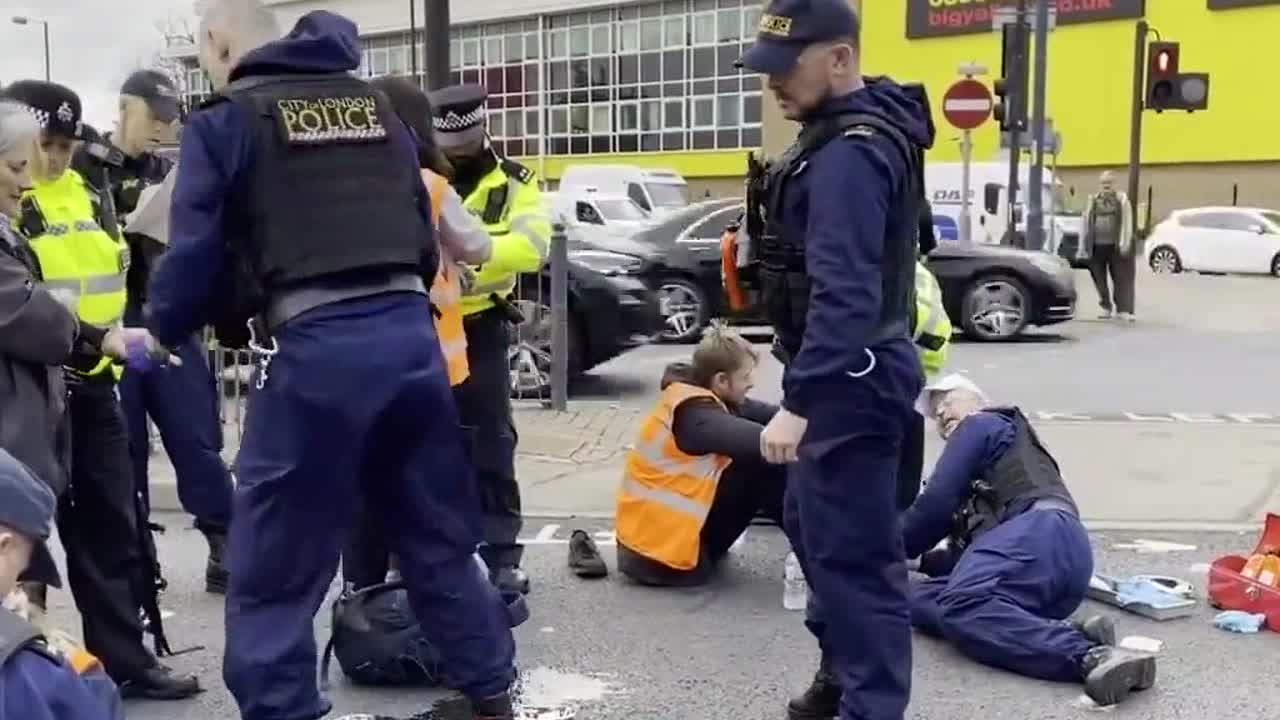 Insulate Britain Protesters Splashed With Black Ink.