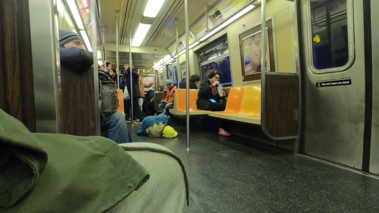 Migrates are sleeping on the floor on NYC Trains Mayor Eric Adams Fails.