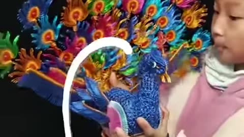 Watch this little girl make art with iron wires