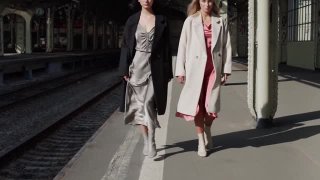 women-modeling-in-a-train-station