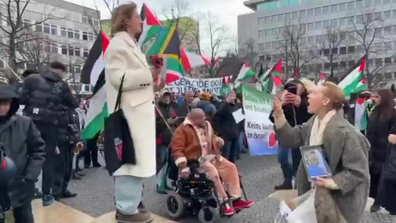 At anti Israel protest in Germany a woman with the sign of “rape isn’t resistance”