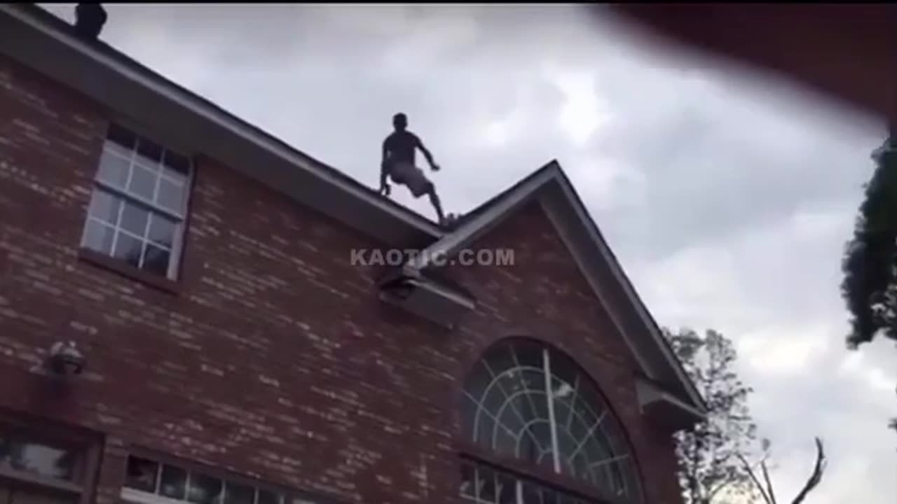 dude attempts to jump off roof into pool. FAILED!