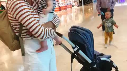 Cute baby waiting for a flight transfer