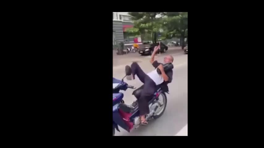 Old man performing motorbike