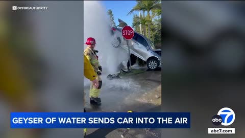Car suspended in air by water gushing from fire hydrant after crash in Lake Forest