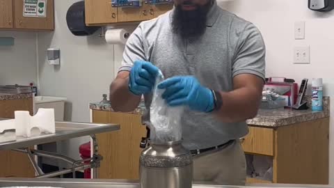 Transferring a loved ones cremains from the temporary container to an urn