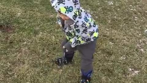 Toddler fails at golf swing