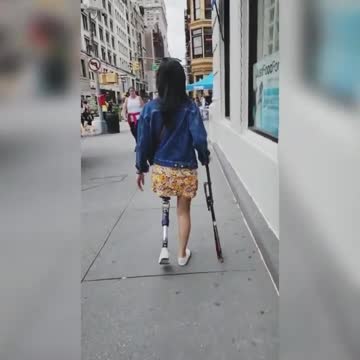 Amputee walking along New York