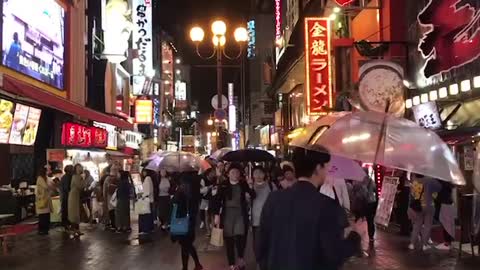 The downtown of Osaka where it's raining.