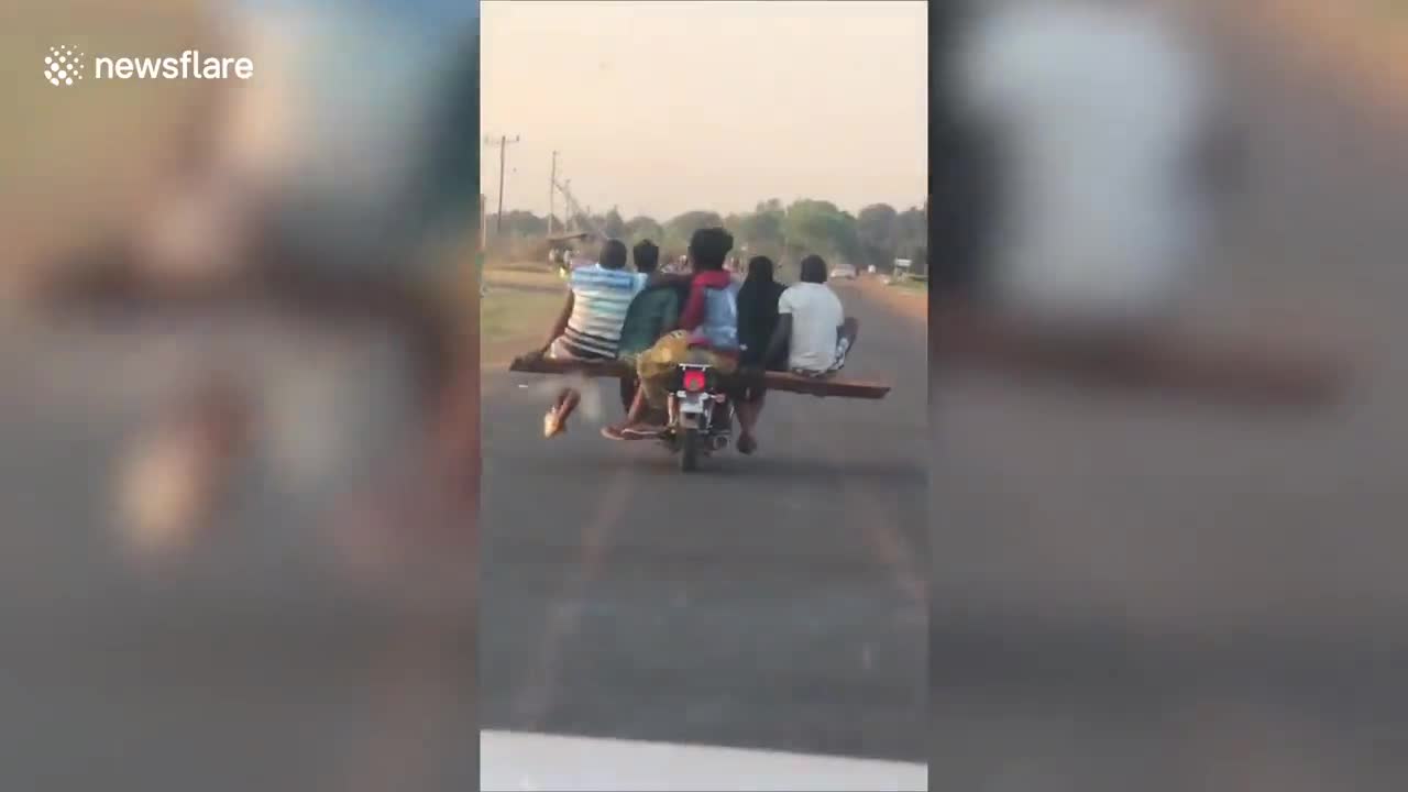 Skilful rider carries FIVE passengers on his motorbike