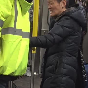 Woman black jacket shaved heat pony tail