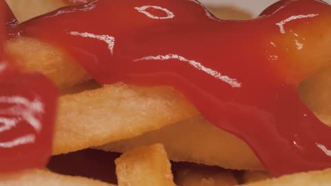 Texture of french fries with ketchup, macro close up