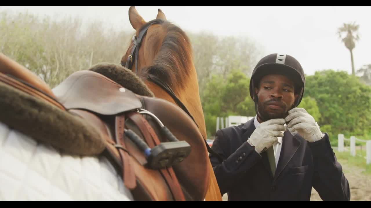 African American man ready to ride his Dressage horse