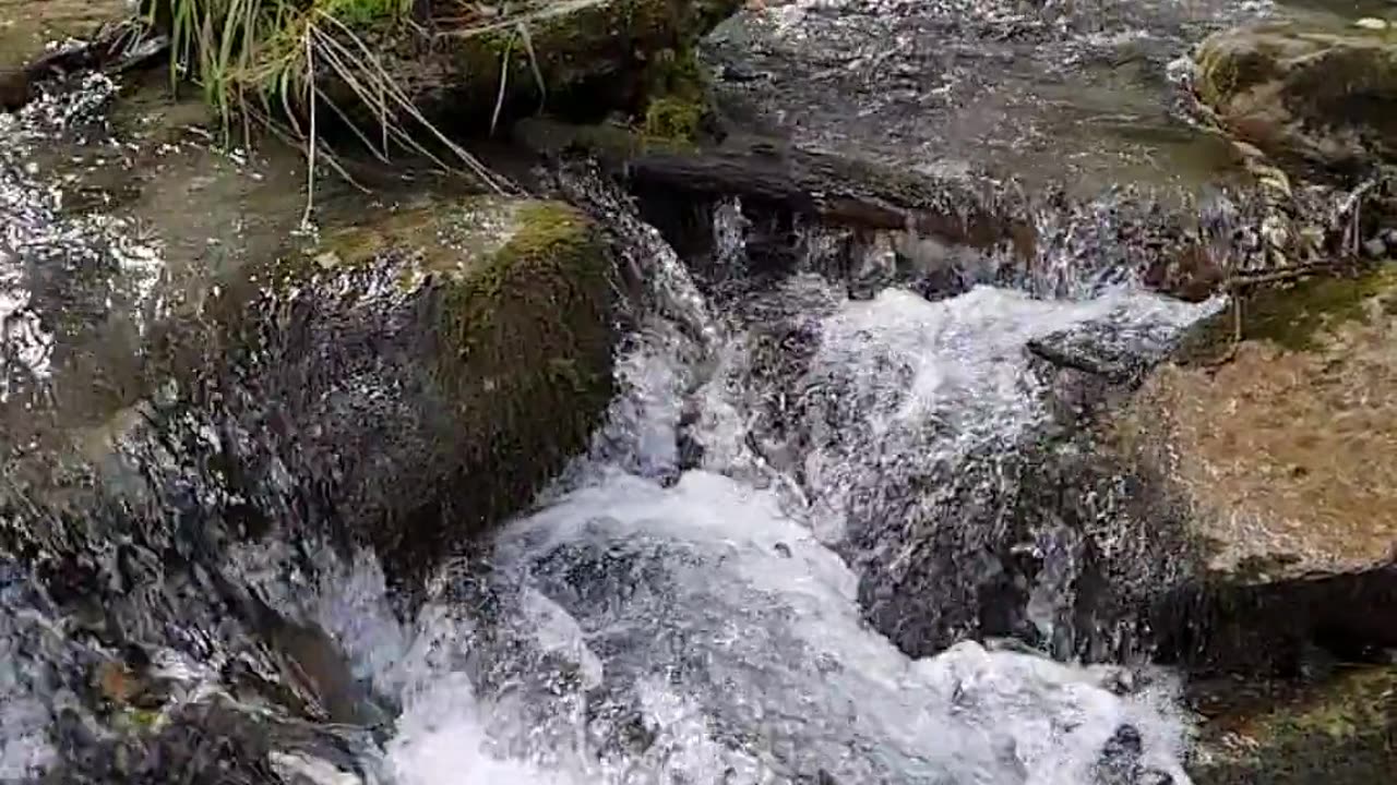 Beautiful views of Hilly water flowing on rock