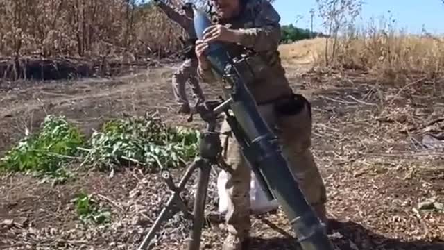 Ukrainian soldiers fire 120mm rounds towards Russian positions