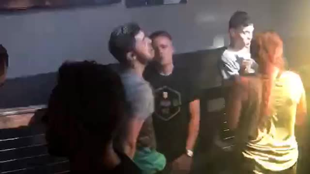 Music guy dancing at bar weirdly with friend
