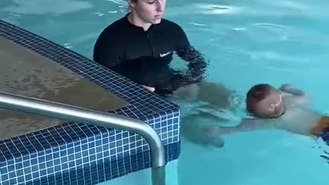 baby swimming alone, very cute