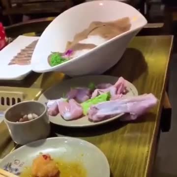 Raw chicken seemingly crawls off table by itself