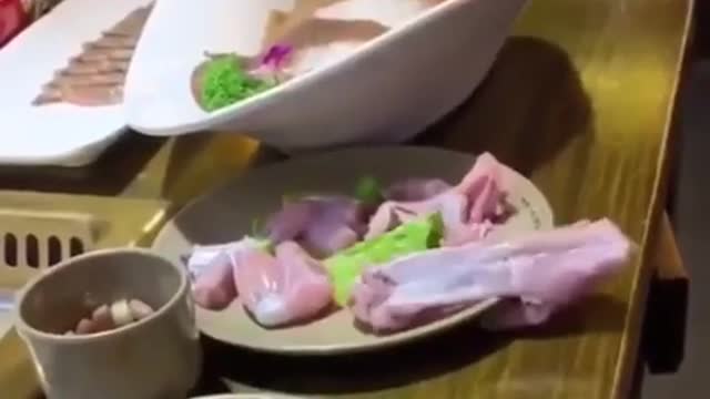 Raw chicken seemingly crawls off table by itself