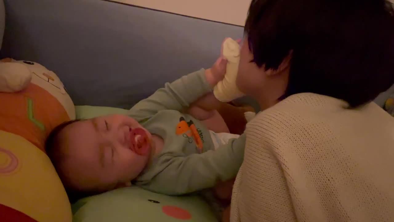 Daul plays with his mother before going to sleep