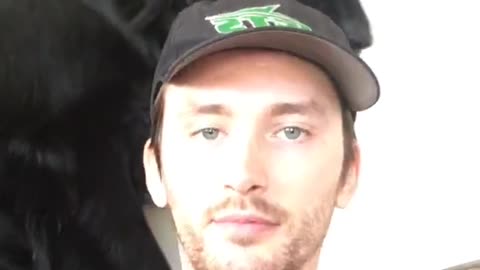 Sunday checkin dog steals hat off man's head