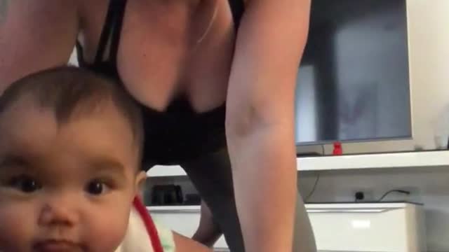 Mom helps baby crawl and then baby spits up