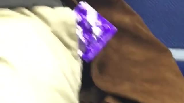 Big night ahead man with purple condom in pocket